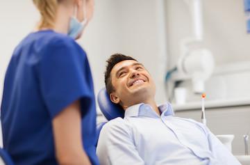 Emergency Dentistry Man smiling at hygienist